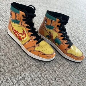 Boys size 7. Charizard fire blast J1 sneakers. Jordan one mid taxis
